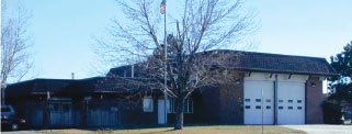 Fire station that is an example of the late Neo-Mansard form.
