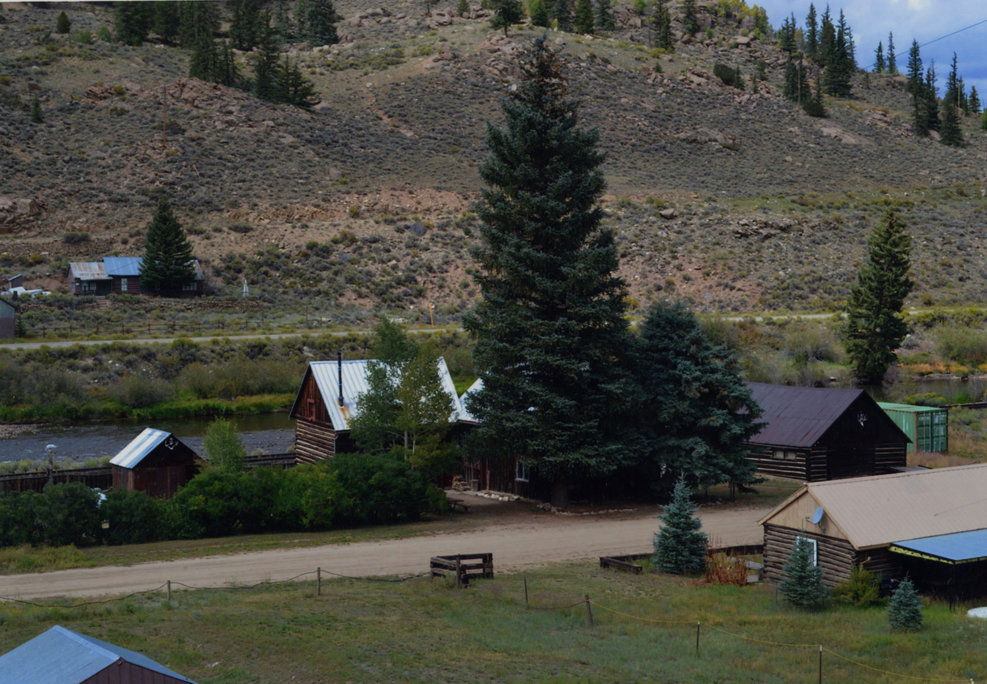 Commercial Hotel in Granite along with associated log outbuildings.