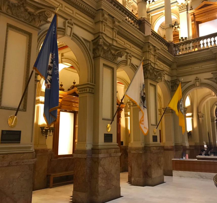 Three Ute tribal flags hung in the State Capitol building