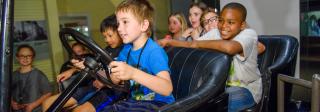 Kids in car in exhibit