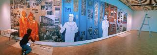 Artist Adri Norris making progress on the Five Points Plus exhibit mural.