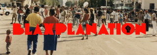 Historic color photo of people on a street with the logo for Blaxplanation superimposed over the photo