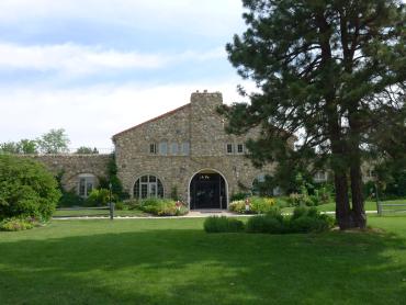 Image of the cobblestone exterior of the Kistler Stables main clubhouse building.